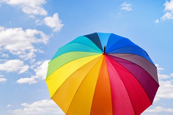 colorful umbrella with blue sky in the background